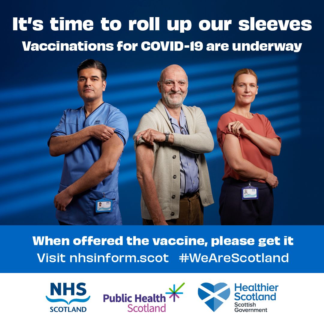 image with 3 people rolling up their sleeves for vaccination